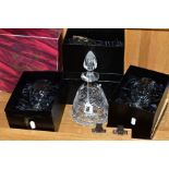 FIVE PIECES OF BOXED ROYAL BRIERLEY CRYSTAL, comprising an oval decanter with vine design height