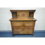 AN OAK COURT CUPBOARD, with an arrangement of cupboard doors over a single long drawer, width