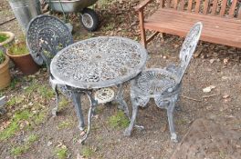 A GREY PAINTED CIRCULAR ALIMINIUM GARDEN TABLE, diameter 66cm with two matching chairs (