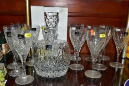 A BOXED ROYAL DOULTON DECANTER OF SHOULDERED OVAL FORM AND A QUANTITY OF ROYAL DOULTON WINE GLASSES,
