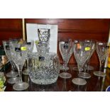 A BOXED ROYAL DOULTON DECANTER OF SHOULDERED OVAL FORM AND A QUANTITY OF ROYAL DOULTON WINE GLASSES,