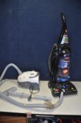 A BISSELL CLEANVIEW UPRIGHT VACUUM CLEANER and a Dirt Devil vacuum cleaner (tube split) (both PAT
