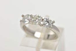 A PLATINUM THREE STONE DIAMOND RING, designed with three round brilliant cut diamonds in a four claw