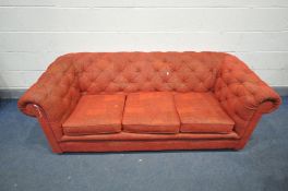 A RED UPHOLSTERED THREE SEATER BUTTON BACK SOFA, length 190cm (condition - general signs of usage)