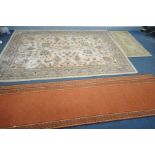 A LATE 20TH CENTURY WOOLEN RUG, of a foliate design within a beige field, with a multistrap