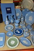 A GROUP OF WEDGWOOD JASPERWARE, mainly pale blue including bud vases, small urn shaped vases, a