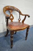 A LATE 19TH CENTURY MAHOGANY OFFICE ARMCHAIR with a red leather seat pad (condition:-rickety frame)