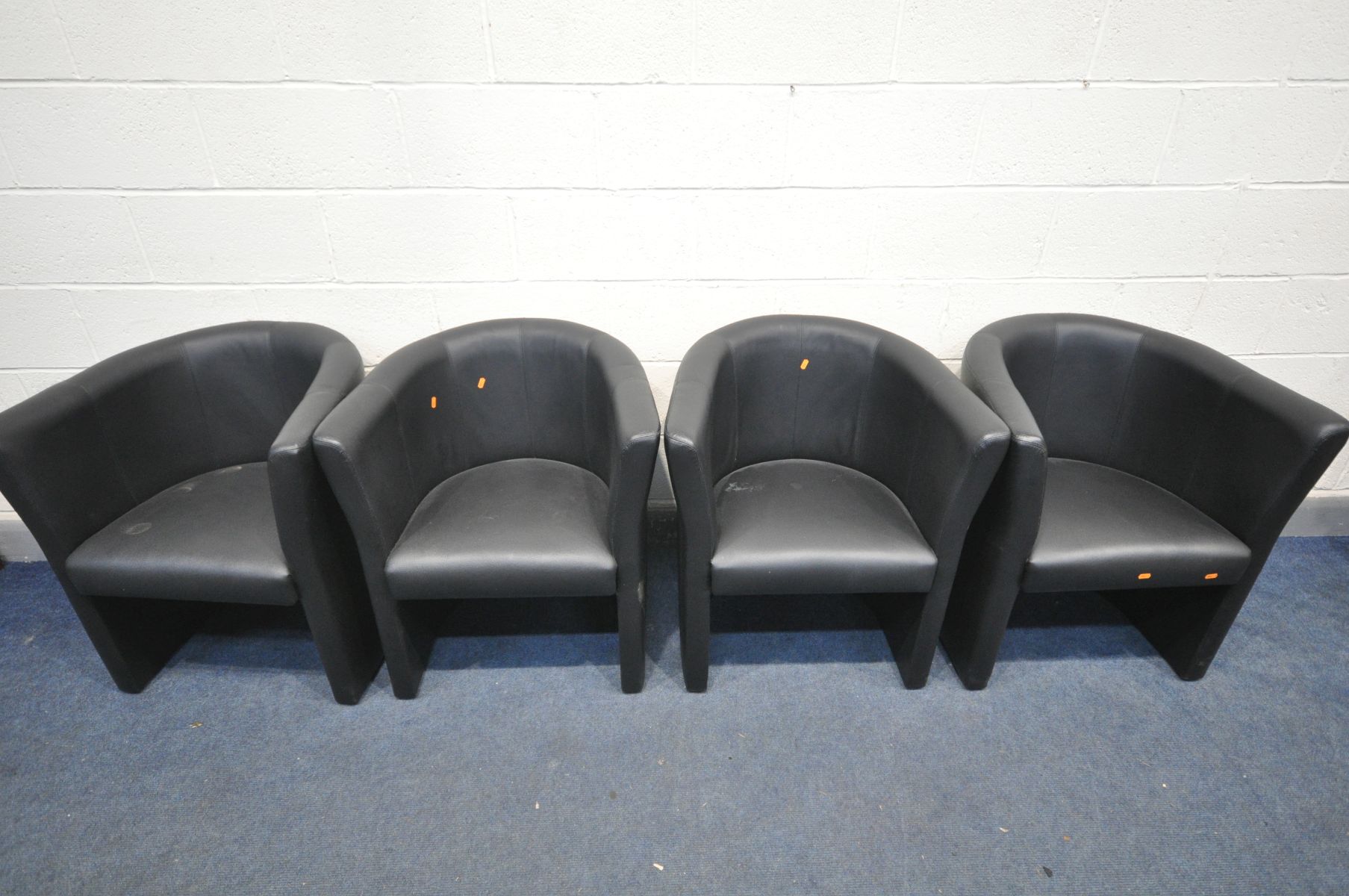 A SET OF FOUR MATCHING BLACK LEATHERETTE TUB CHAIRS