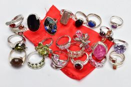 A SELECTION OF WHITE METAL RINGS, twenty one dress rings, all set with either semi-precious
