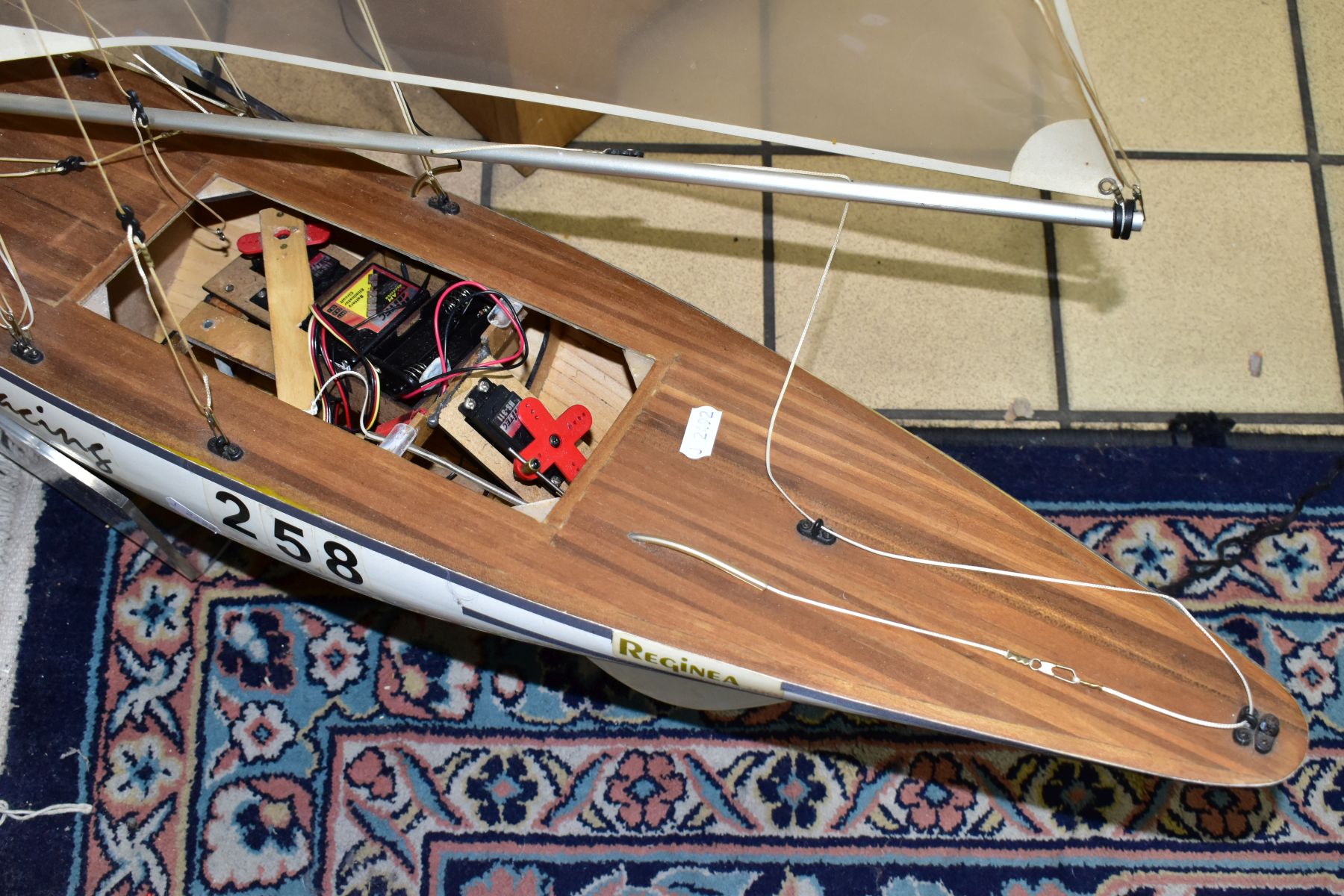 A SCRATCH BUILT MODEL YACHT, at full sail, the deck with rigging and clear sails, motor in hull, - Image 4 of 8