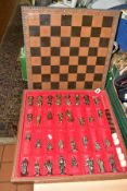 A LATE 2OTH CENTURY LEATHER EFFECT BOUND CHESS AND BACKGAMMON SET. the lift off board with