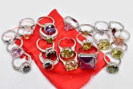 A SELECTION OF WHITE METAL RINGS, twenty one dress rings, all set with either semi-precious