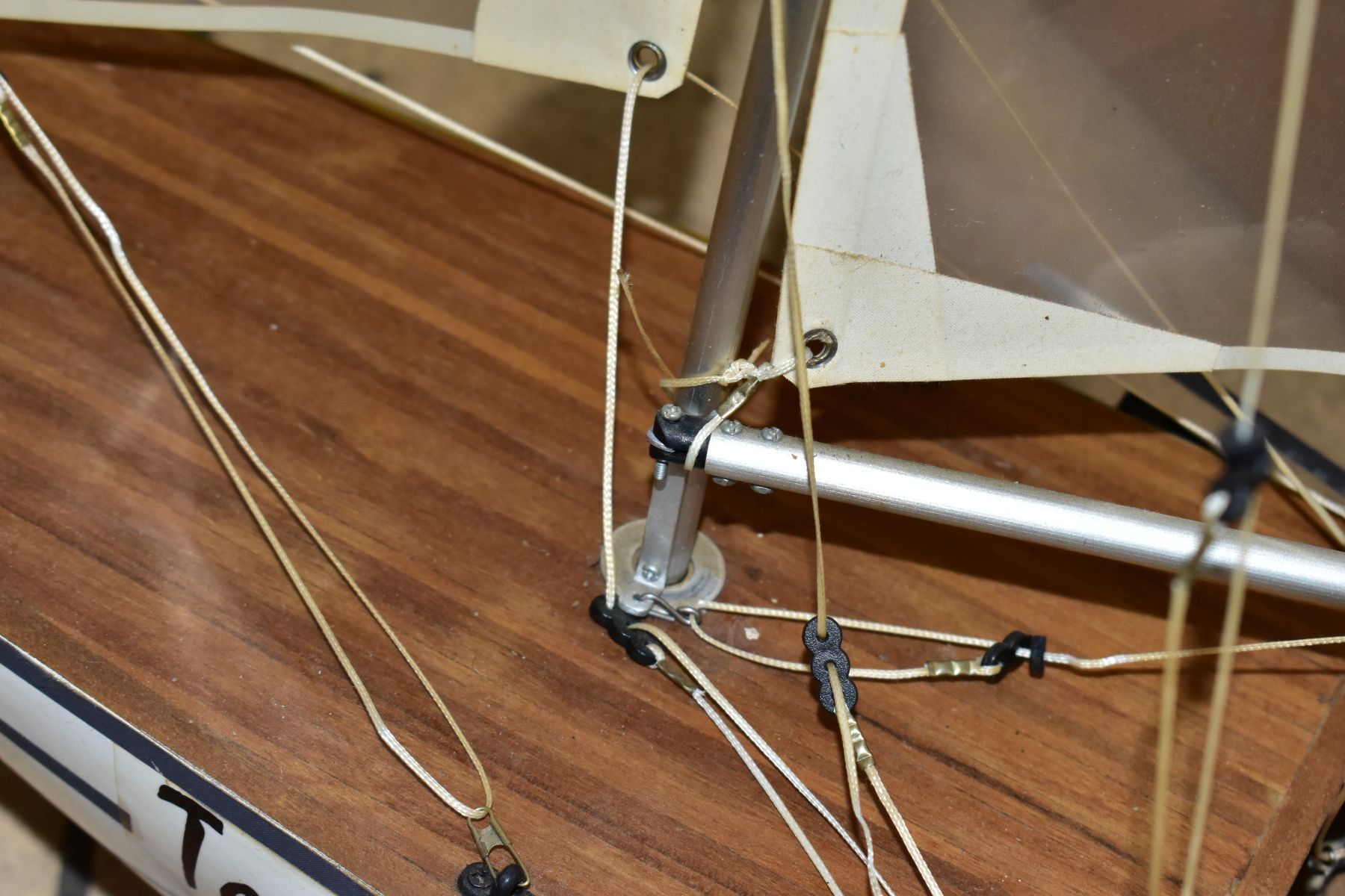 A SCRATCH BUILT MODEL YACHT, at full sail, the deck with rigging and clear sails, motor in hull, - Image 6 of 8