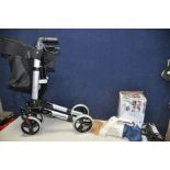 A COOPERS FREEDOM LITE ROLLATOR and a Black and Decker AC7000 POWERBRUSH hand held vacuum cleaner