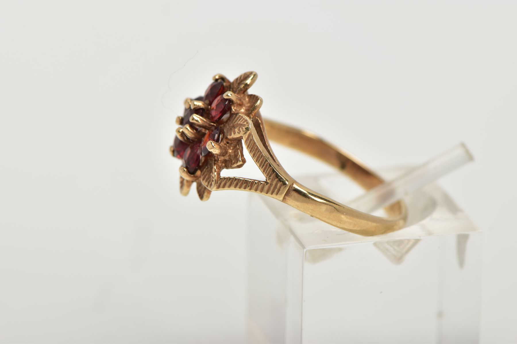 A 9CT GOLD GARNET FLORAL CLUSTER RING, designed as a circular shape stepped garnet cluster, with - Image 2 of 4