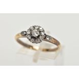 A YELLOW METAL DIAMOND CLUSTER RING, of a circular design, slightly tiered cluster set with old