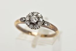 A YELLOW METAL DIAMOND CLUSTER RING, of a circular design, slightly tiered cluster set with old