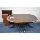 A REGENCY STYLE MAHOGANY AND CROSSBANDED TWIN PEDESTAL DINING TABLE, with a single additional