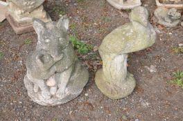 A COMPOSITE GARDEN ORNAMENT OF A FOX and its offspring together with an ornamental figure of a