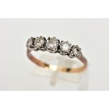 A YELLOW METAL FIVE STONE DIAMOND RING, designed with a row of five graduated illusion set old cut