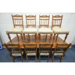 AN EDWARDIAN WALNUT EXTENDING DINING TABLE, with two additional leaves, on fluted legs, extended