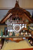 A SCHNEIDER MUSICAL CUCKOO CLOCK, the movement has either a cuckoo or bell strike action with a