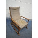 A MID CENTURY WALNUT FRAMED 'FURPRO TRAMPOLINE' ROCKING CHAIR, with beige and striped upholstery,