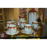 A 1920'S RUDOLPH WACHTER GREEN AND ORANGE LUSTRE OCTAGONAL FOURTEEN PIECE PORCELAIN COFFEE SET,