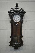 A LATE 19TH CENTURY SERPENTINE WALNUT AND EBONISED VIENNA WALL CLOCK, with an acorn finial and