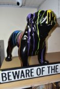 A LARGER THAN LIFE SIZE FIBRE GLASS MODEL OF A BULLDOG, black ground with paint splatter style