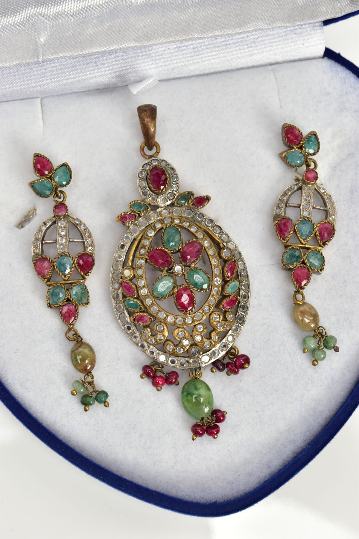 A GEM SET PENDANT AND MATCHING EARRINGS, each drop earring is set with low quality dyed red and