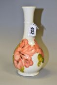 A MOORCROFT POTTERY ONION SHAPED VASE WITH CORAL HIBISCUS ON A CREAM GROUND, impressed marks and