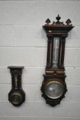 AN EDWARDIAN OAK ANEROID BAROMETER, signed Thomas Armstong and Brothers, with a spiralling mercury