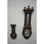 AN EDWARDIAN OAK ANEROID BAROMETER, signed Thomas Armstong and Brothers, with a spiralling mercury