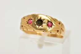 A LATE 19TH CENTURY GOLD RING, a band ring with scroll detailing set with two red circular cut