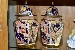 A PAIR OF MASON'S YELLOW SIAM COVERED VASES, of hexagonal form with pineapple shaped finial, printed