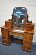 A VICTORIAN FLAME MAHOGANY PEDESTAL DRESSING TABLE, with a single mirror and an arrangement of