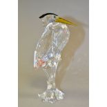 A SWAROVSKI CRYSTAL HERON, retired item from the Feathered Friends series, no 221627, standing in