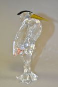 A SWAROVSKI CRYSTAL HERON, retired item from the Feathered Friends series, no 221627, standing in