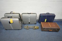 A BRASS THREE PIECE COMPANION SET with stands, along with a vintage suitcase, and four various