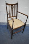 AN EDWARDIAN MAHOGANY AND INLAID ELBOW CHAIR, with beige upholstery (Sd to finial and single scratch