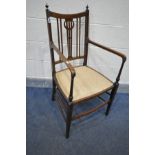 AN EDWARDIAN MAHOGANY AND INLAID ELBOW CHAIR, with beige upholstery (Sd to finial and single scratch