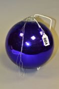 A PURPLE GLASS WITCH'S BALL, with metal mount and hanging loop, diameter approximately 17cm (