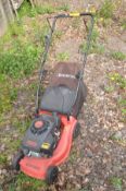 A CHAMPION PETROL LAWNMOWER with grass box (engine pulls freely but not tested)