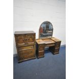 A MID TO LATE 20TH CENTURY OAK TALL BOY, with two carved cupboard doors above three drawers, width