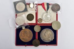 A SMALL PLASTIC BOX OF COINS, containing a cased large sterling silver queen Victoria diamond