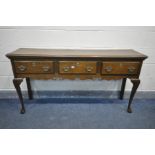 A MID TO LATE 20TH CENTURY OAK DRESSER BASE, with three drawers, on cabriole legs, length 151cm x