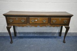 A MID TO LATE 20TH CENTURY OAK DRESSER BASE, with three drawers, on cabriole legs, length 151cm x
