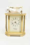 A WOODFORD BRASS MECHANICAL CARRIAGE CLOCK, hexagonal shape, white dial signed 'Woodford Est.