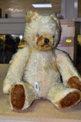 A MID 20TH CENTURY GOLDEN PLUSH JOINTED TEDDY BEAR, centre seam, straw filled, with growler, plastic